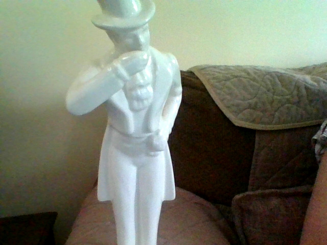 Decorative porcelain or ceramic gentleman figurine