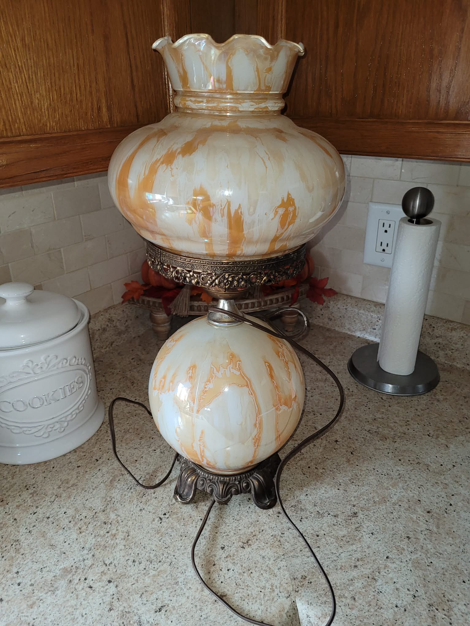 Marbleized glass table lamp with ornate metal base