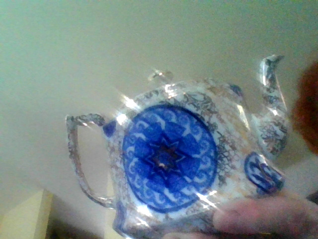 Decorative ceramic teapot or lidded tea service vessel