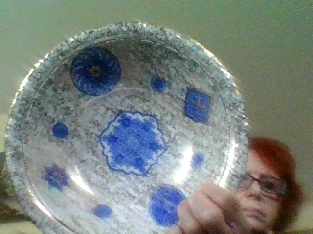 Decorative ceramic or porcelain plate with blue transfer/hand-painted style motifs