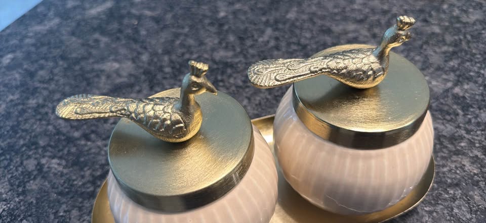 Pair of decorative lidded vanity jars or dresser canisters with peacock finials