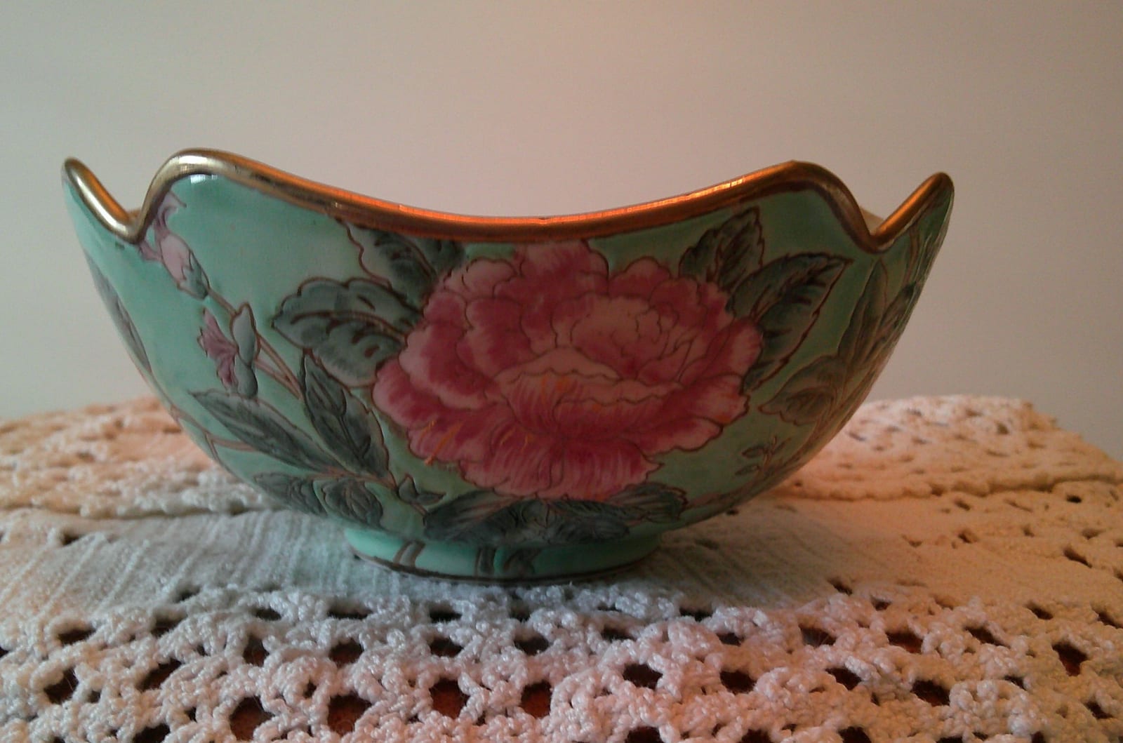 Hand-painted porcelain bowl with floral motif