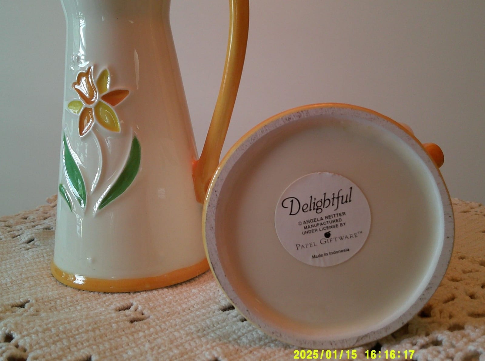 Decorative ceramic pitcher or jug with floral relief design