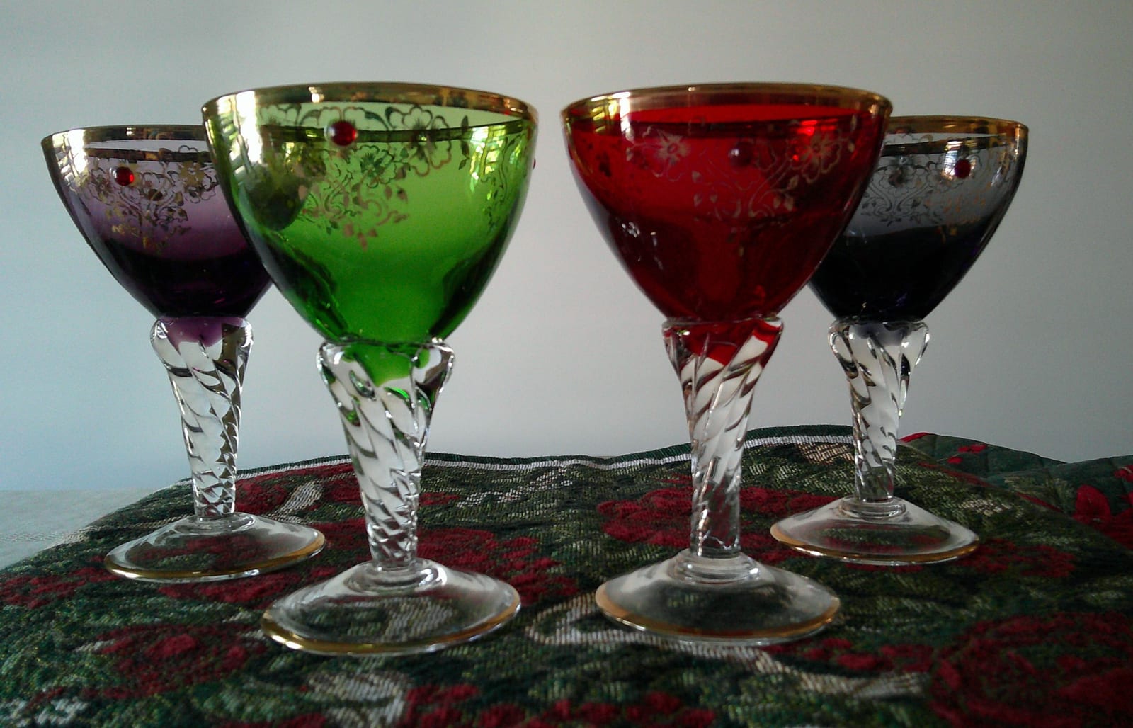 Set of colored cut-to-clear decorative stemmed goblets