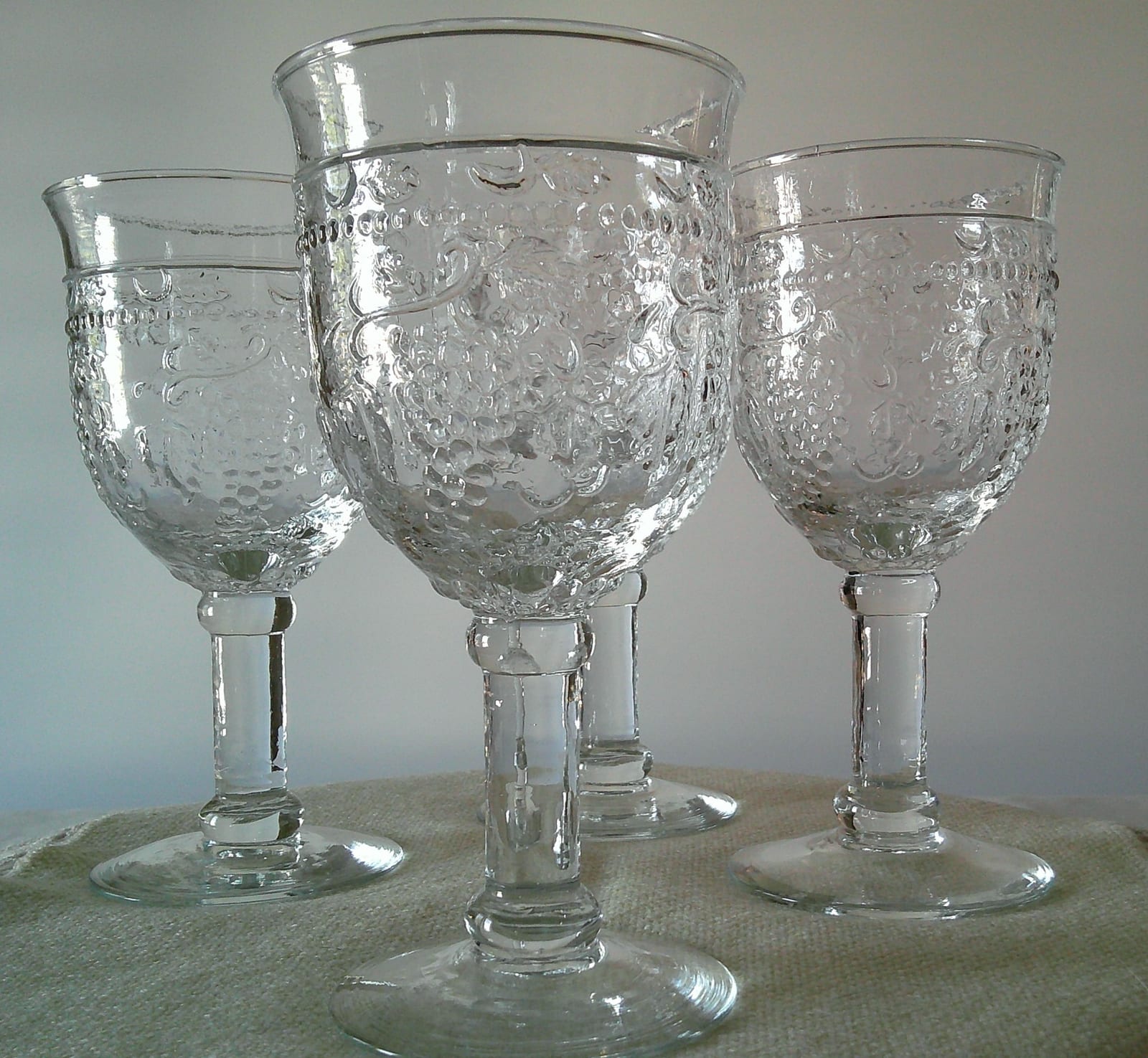 Set of pressed glass stemmed goblets or wine glasses