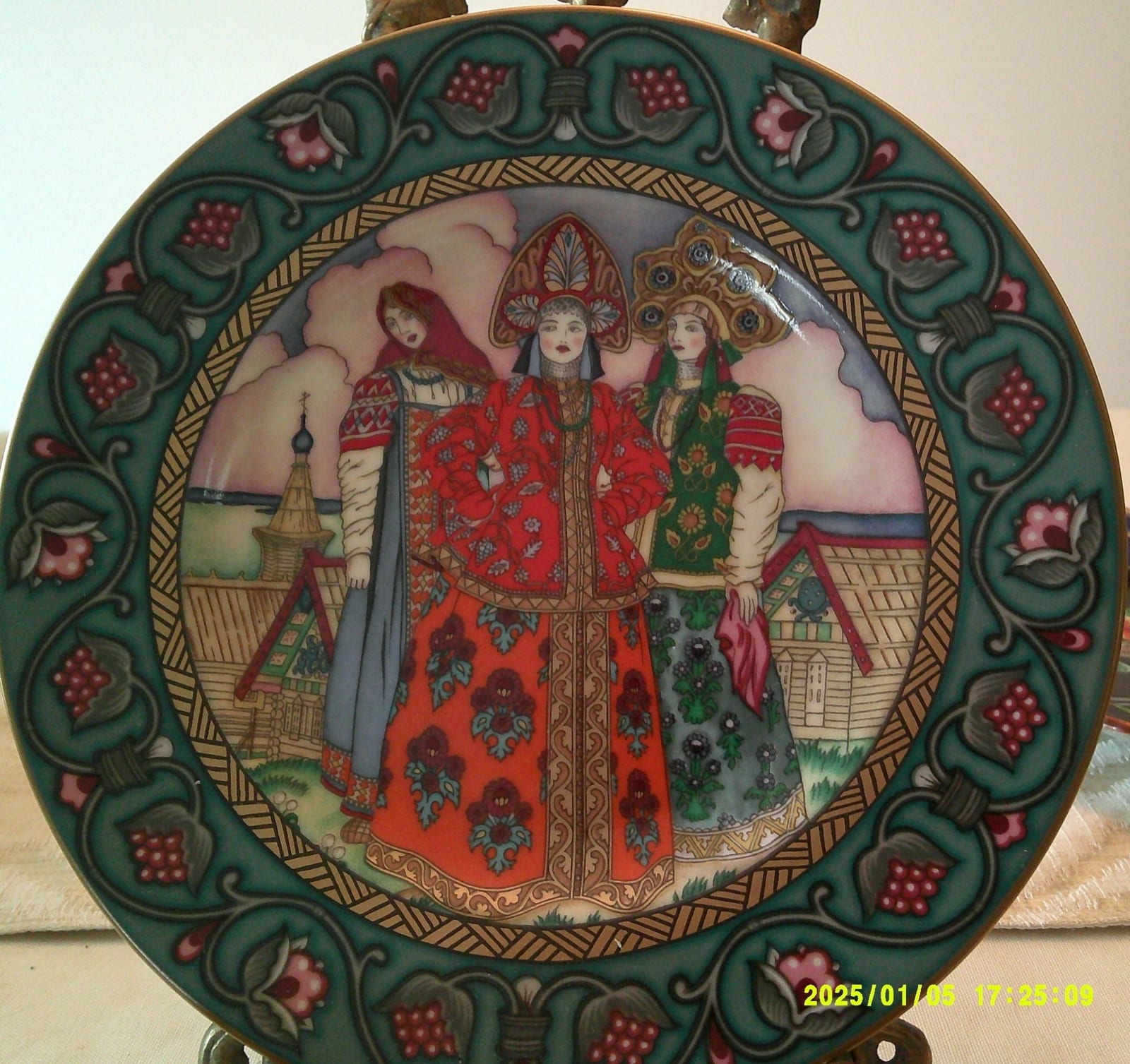 Decorative porcelain plate with Russian folk costume scene