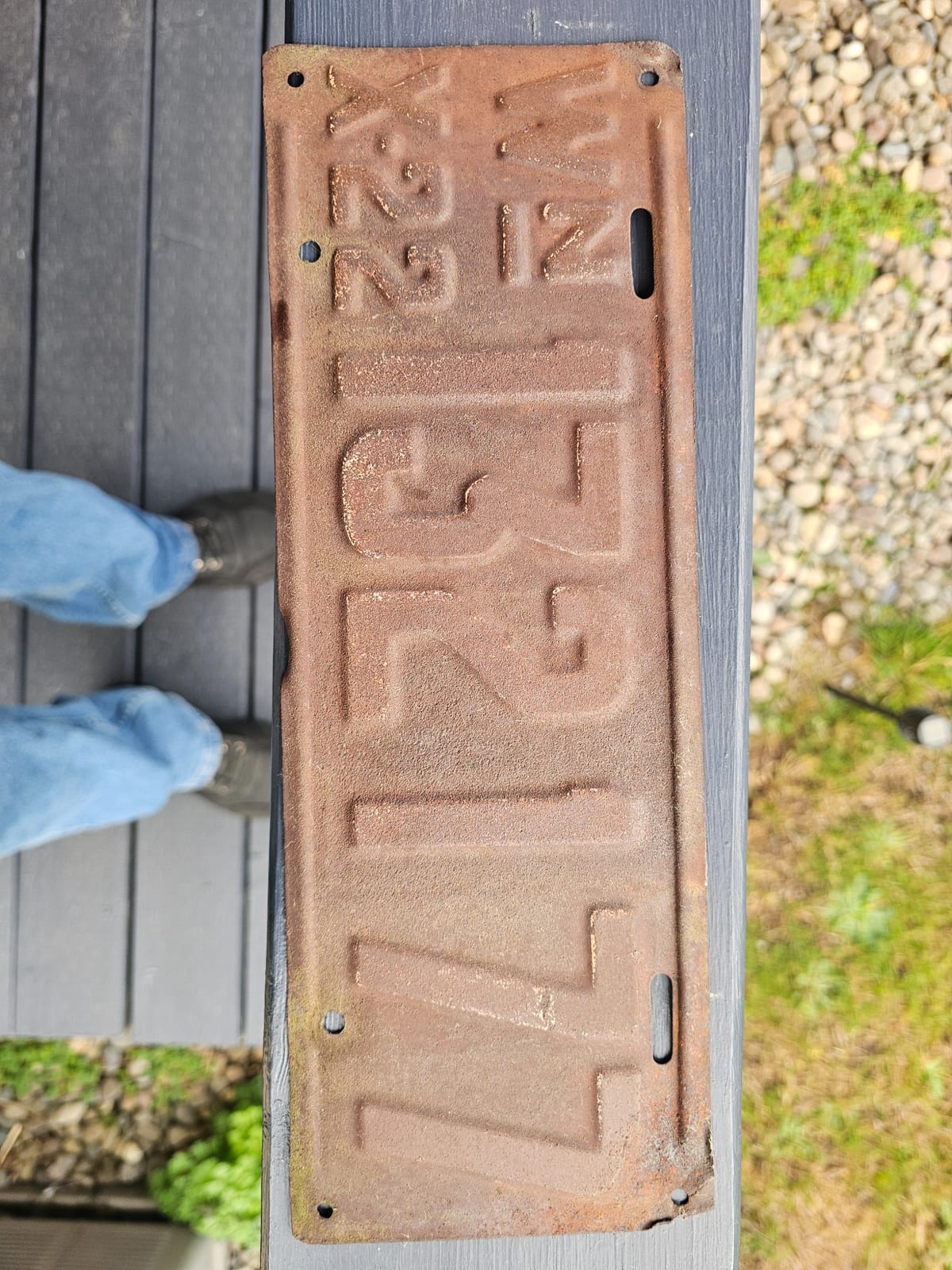 Cast metal architectural sign plate reading "MILLIN" (likely a maker's or place-name plate)