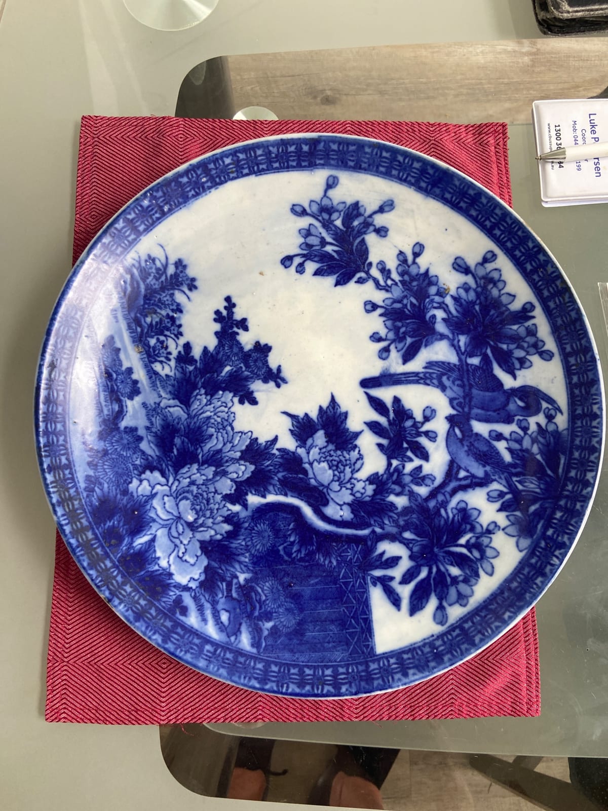 Blue and white porcelain decorative plate with bird-and-flower motif
