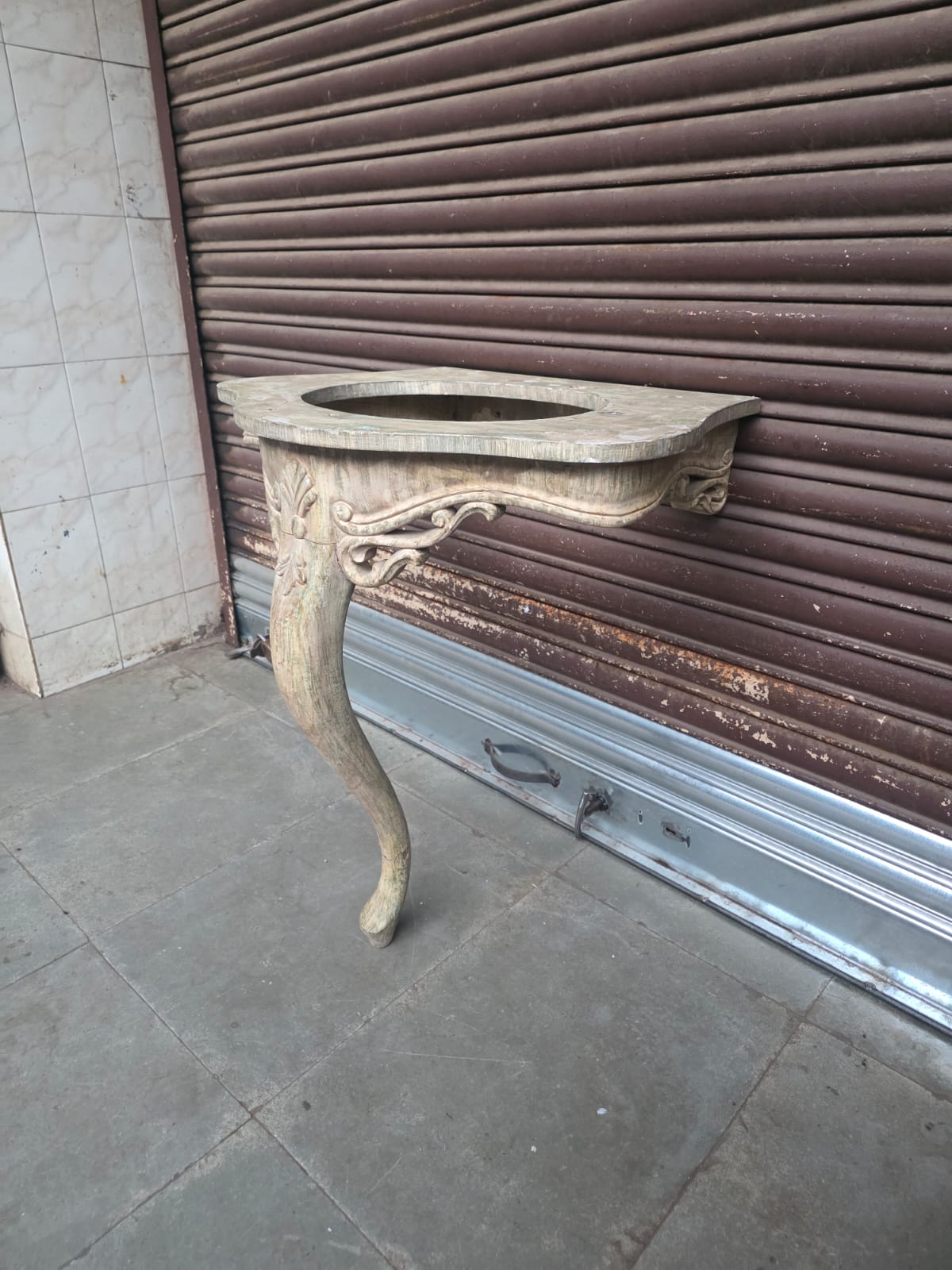 Carved wooden wall-mounted washstand or console with integrated basin opening