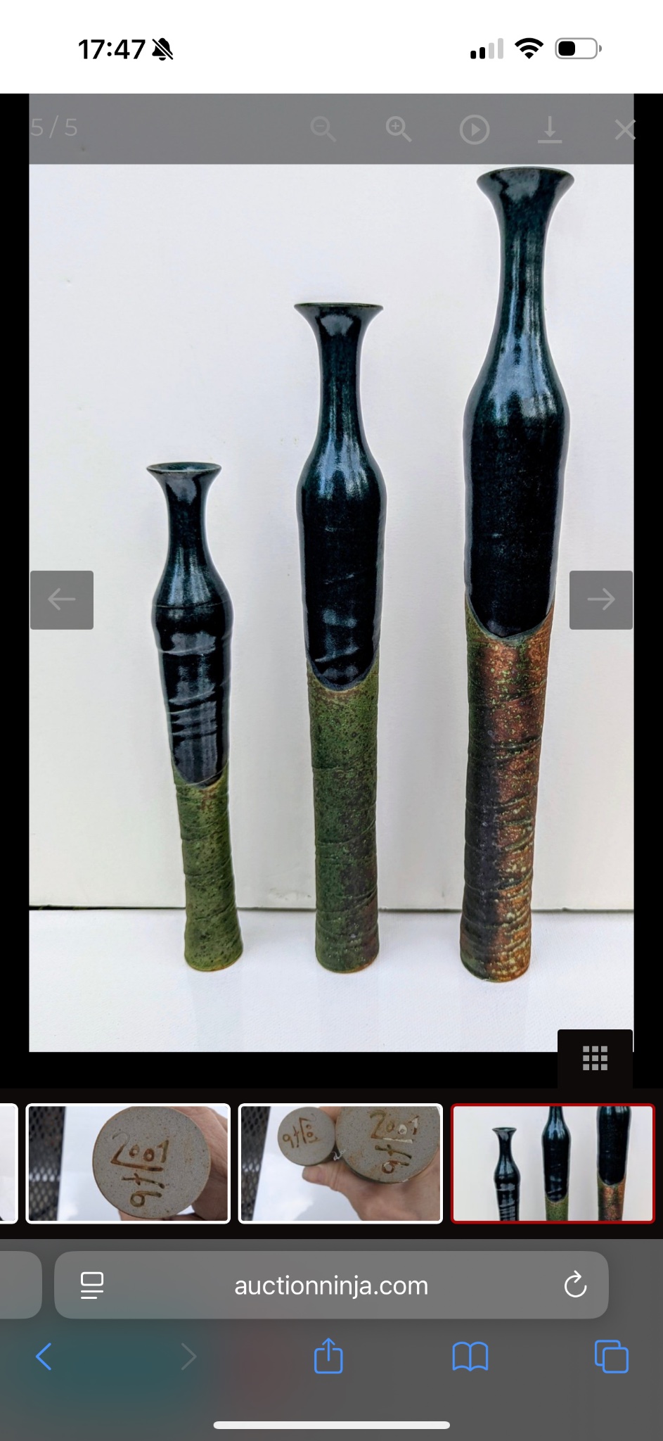 Set of three tall ceramic bottle-form vases