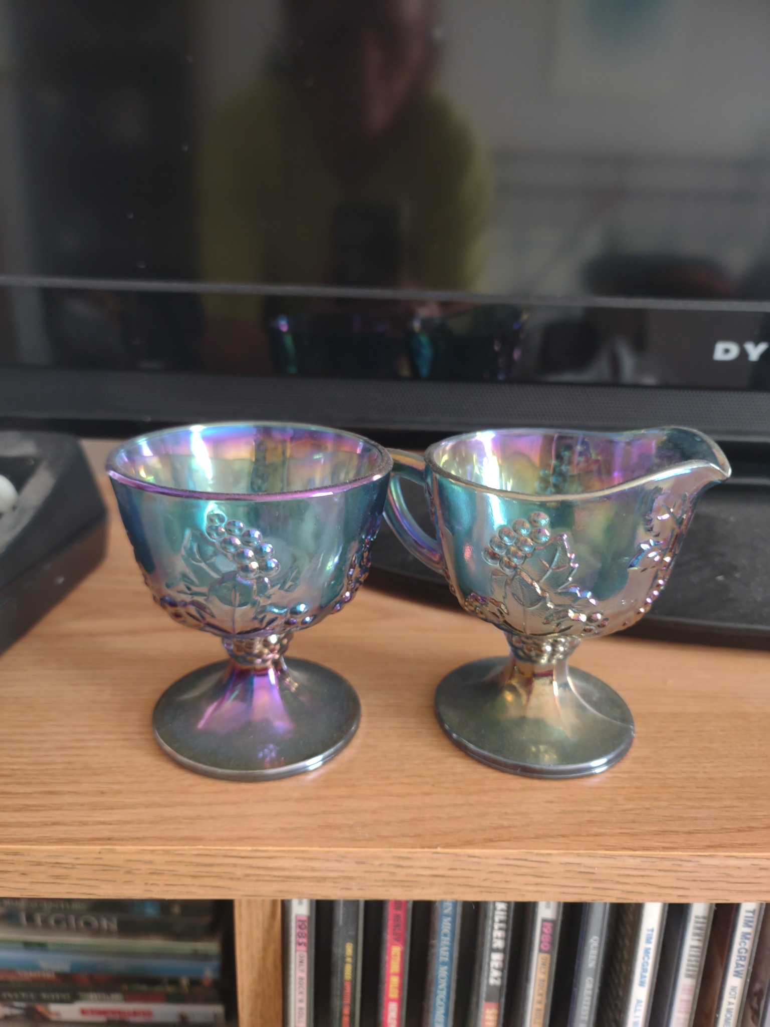 Pair of iridescent pressed-glass pedestal egg cups or small sherbet cups