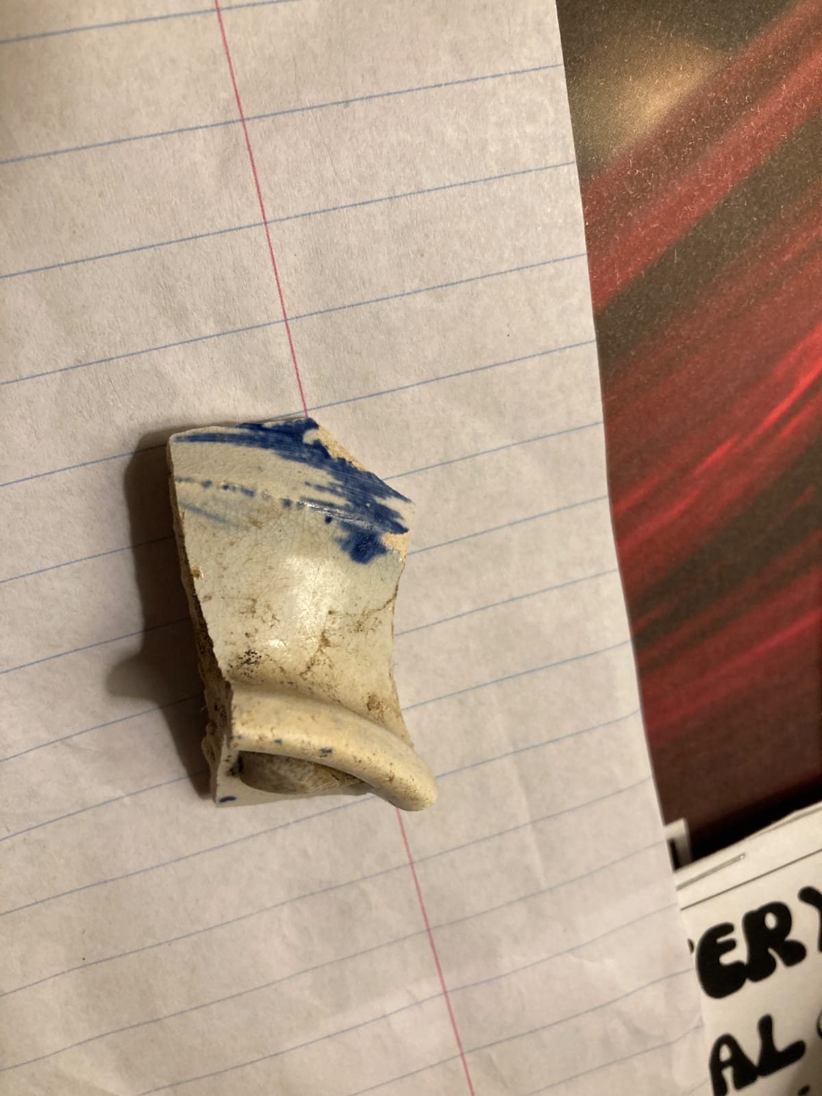 Fragment of blue-and-white ceramic vessel (likely porcelain or earthenware)