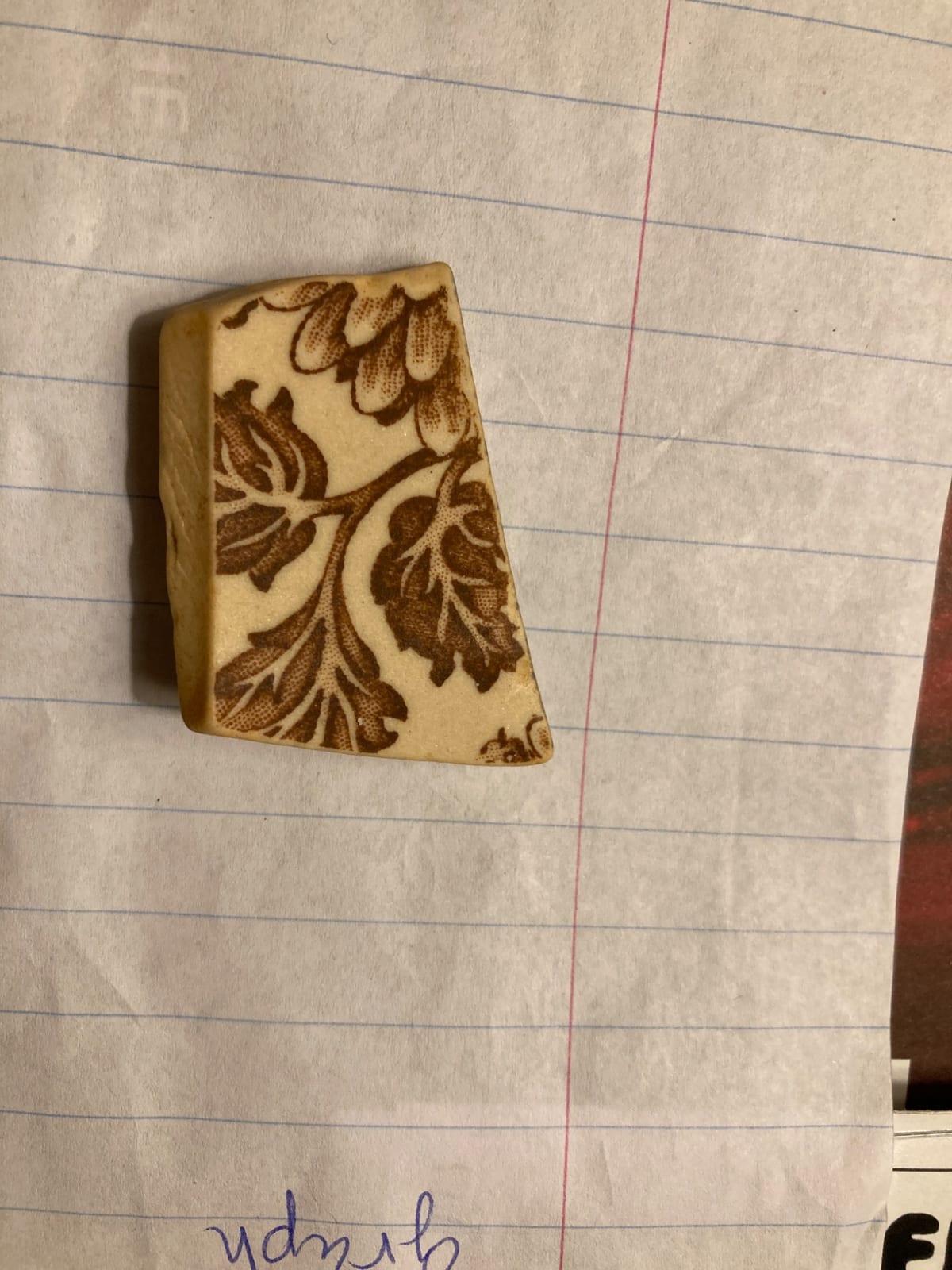 Decorative carved or molded bone/ivory-like block with floral pyrography