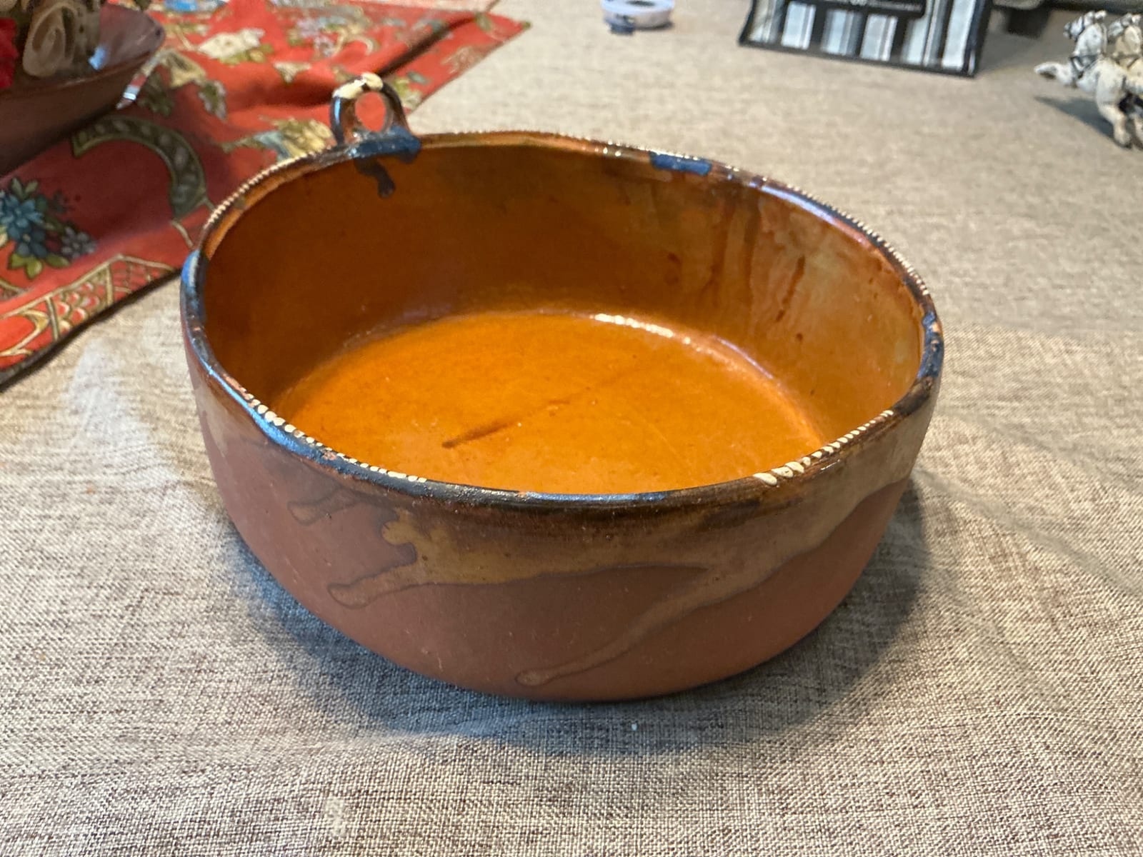 Glazed earthenware bowl or small serving vessel with loop handle