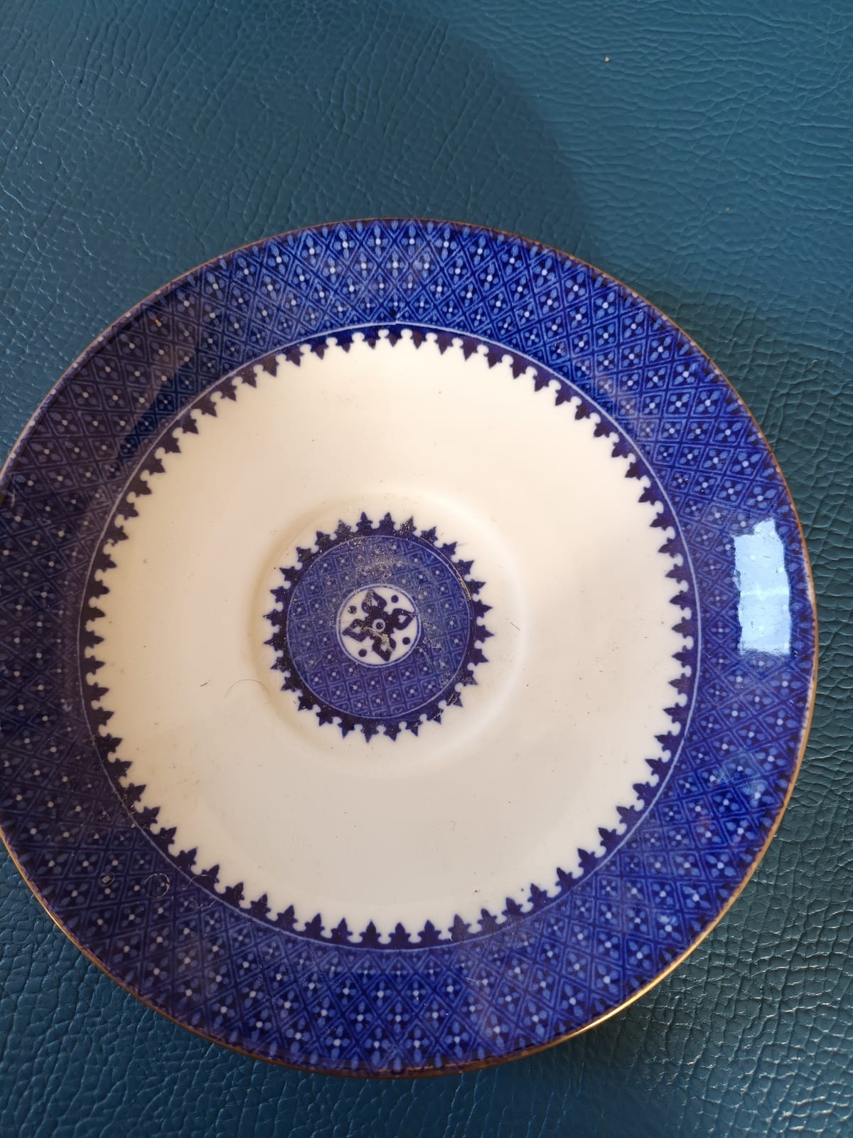 Decorative porcelain saucer or small plate with cobalt blue geometric pattern