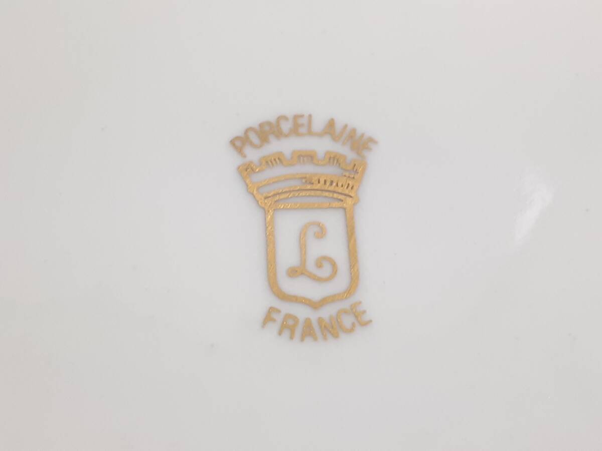 French porcelain tableware piece with gold monogram crest mark