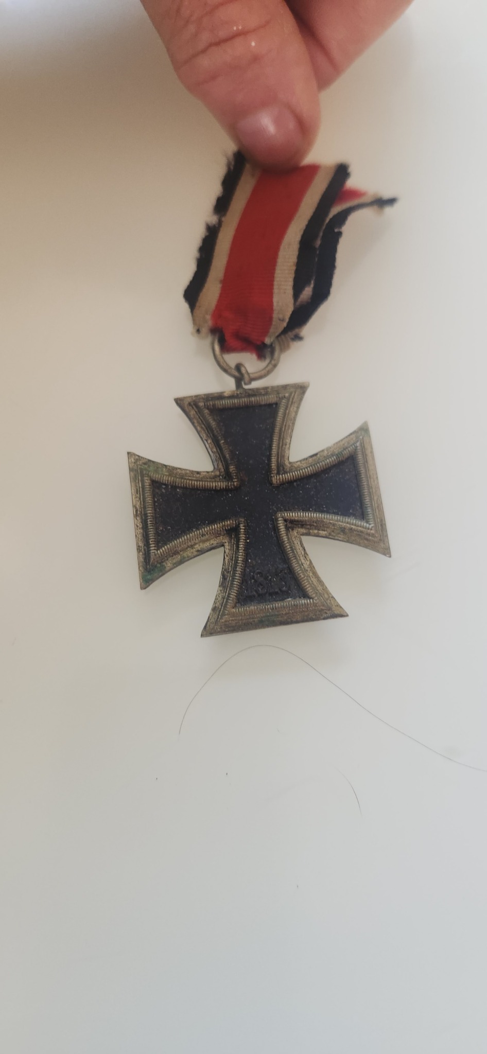 Iron Cross medal (likely German military award, 2nd Class or similar)