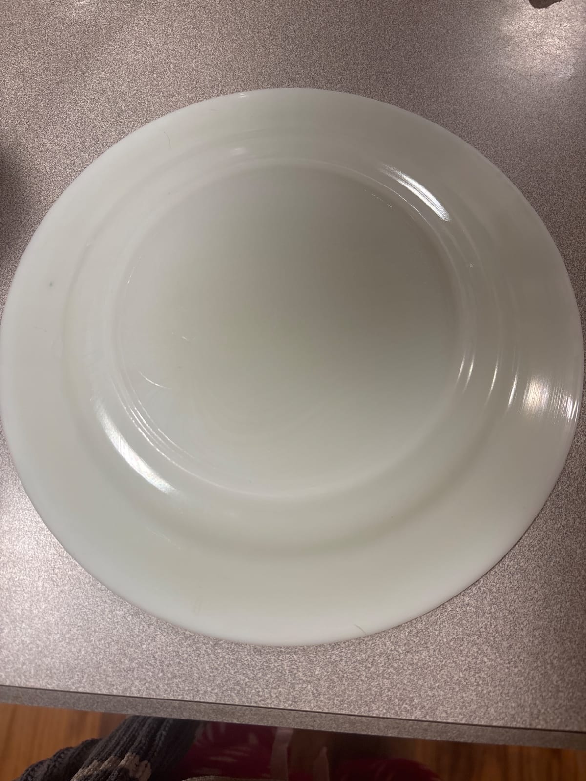 White glazed ceramic dinner plate