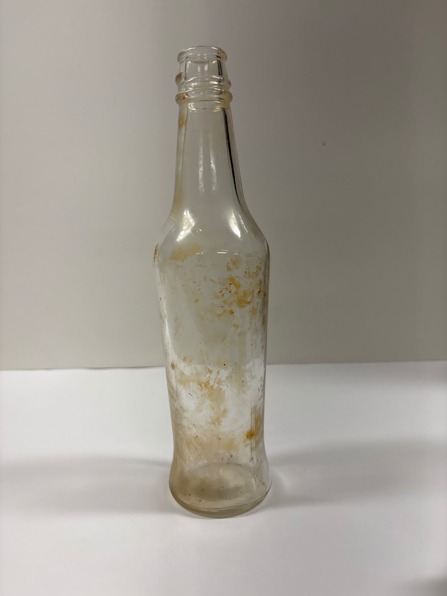Clear glass beverage bottle