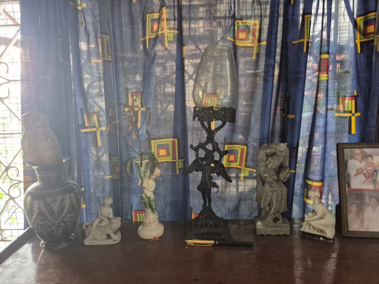 Victorian-style cast metal table lamp with glass shade