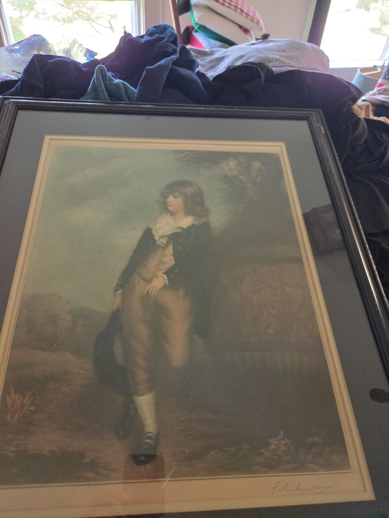 Framed color print or lithograph of a young boy in 18th-century attire
