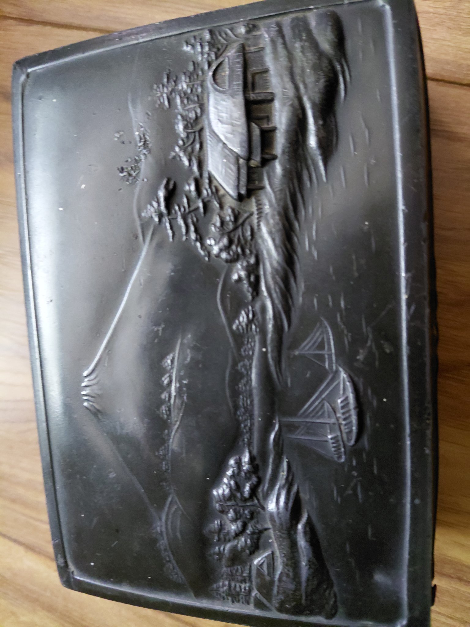 Decorative carved or molded black lacquer box lid/panel with landscape scene