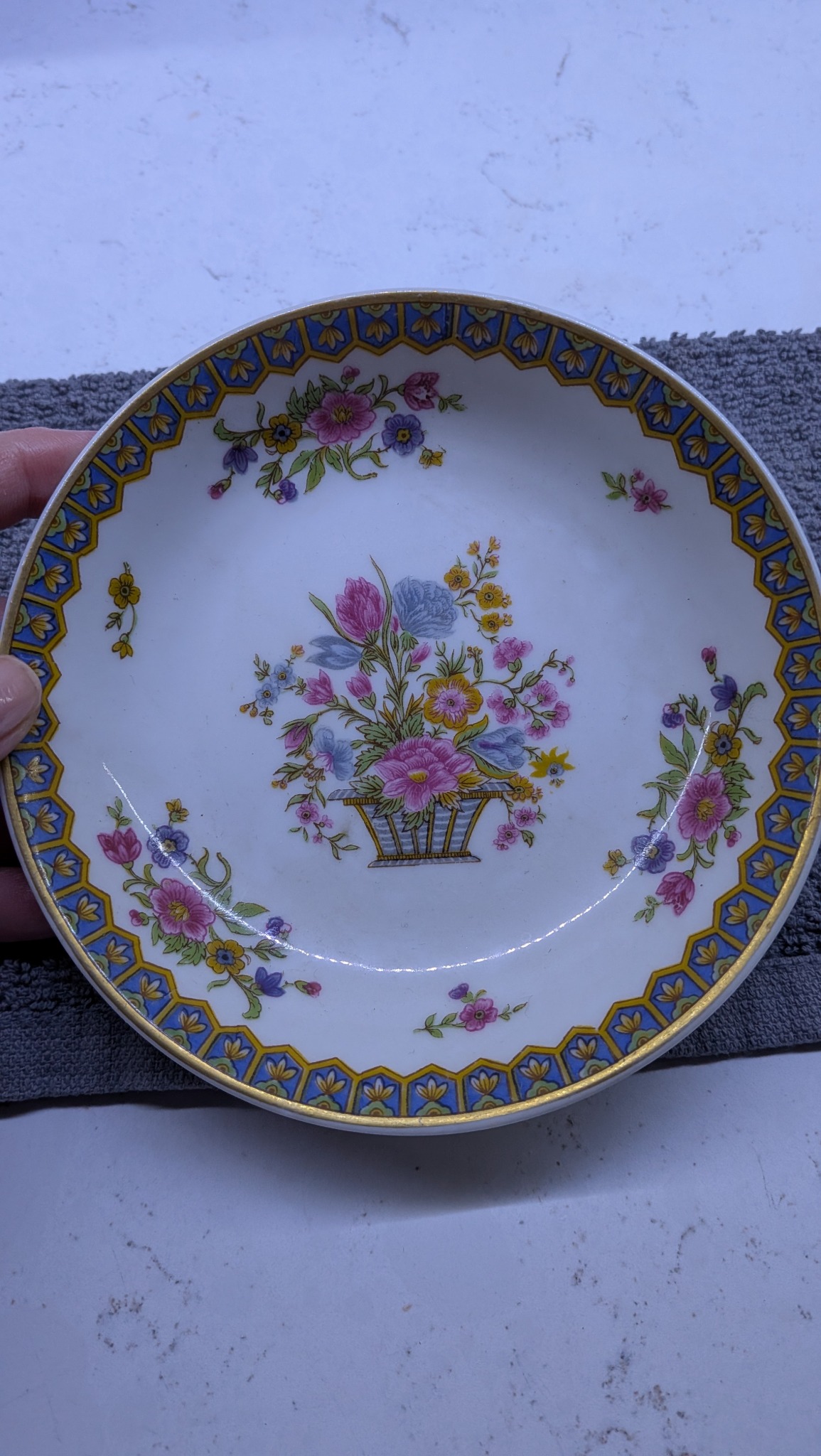 Decorative porcelain dessert plate with floral basket motif