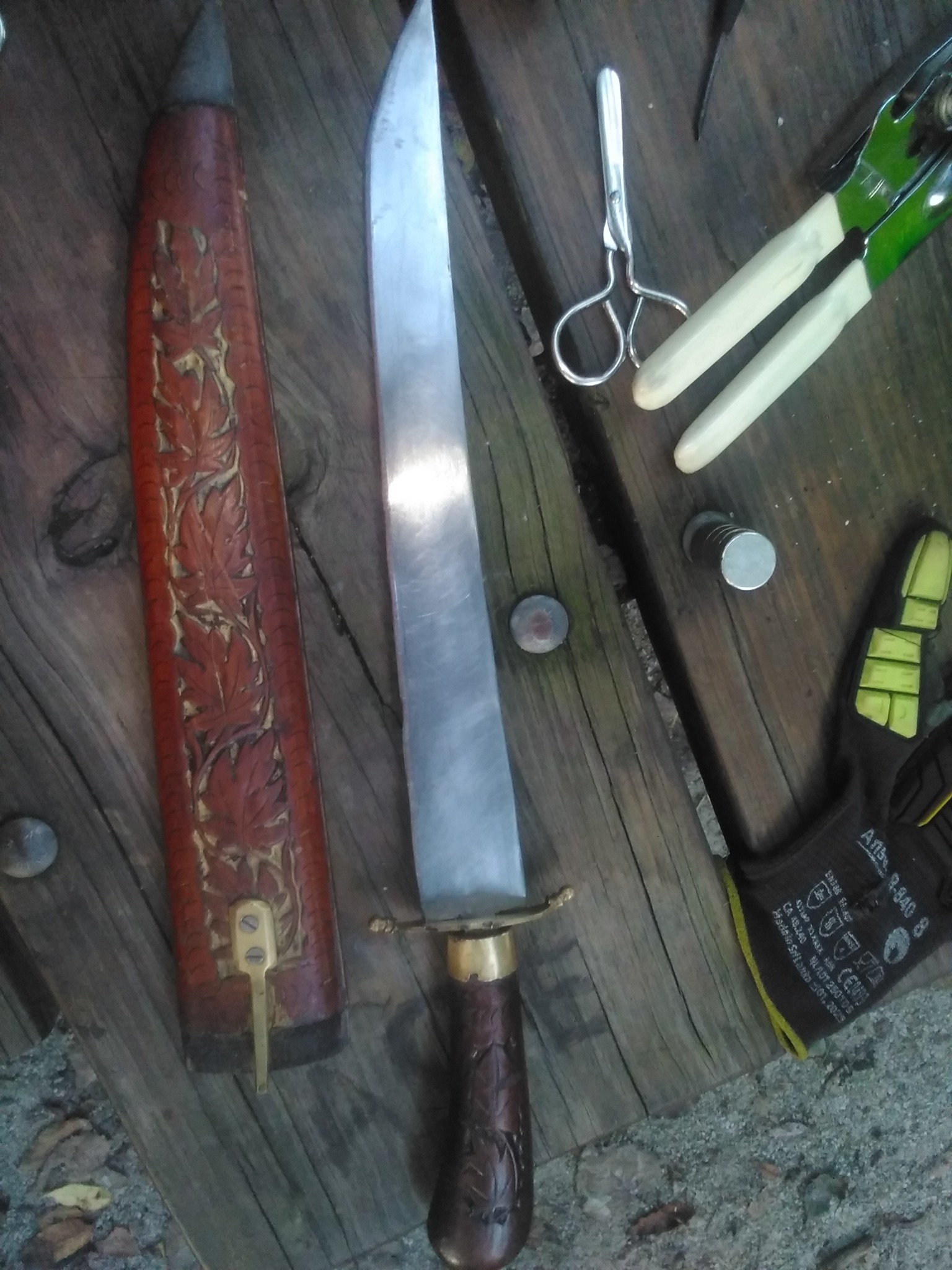 Decorative Filipino-style bolo or machete with carved wooden scabbard
