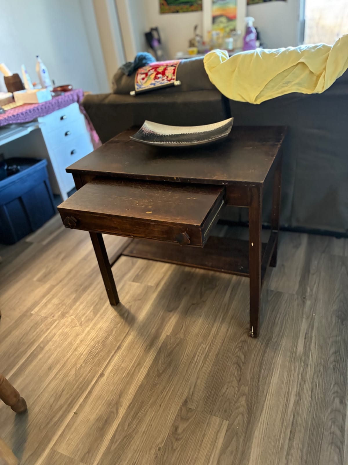 Small wooden side table with pull-out drawer