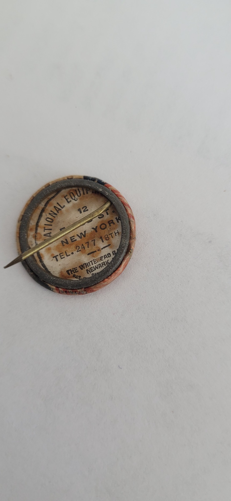 Vintage advertising pinback button or lapel pin with integrated needle/compass-like pointer