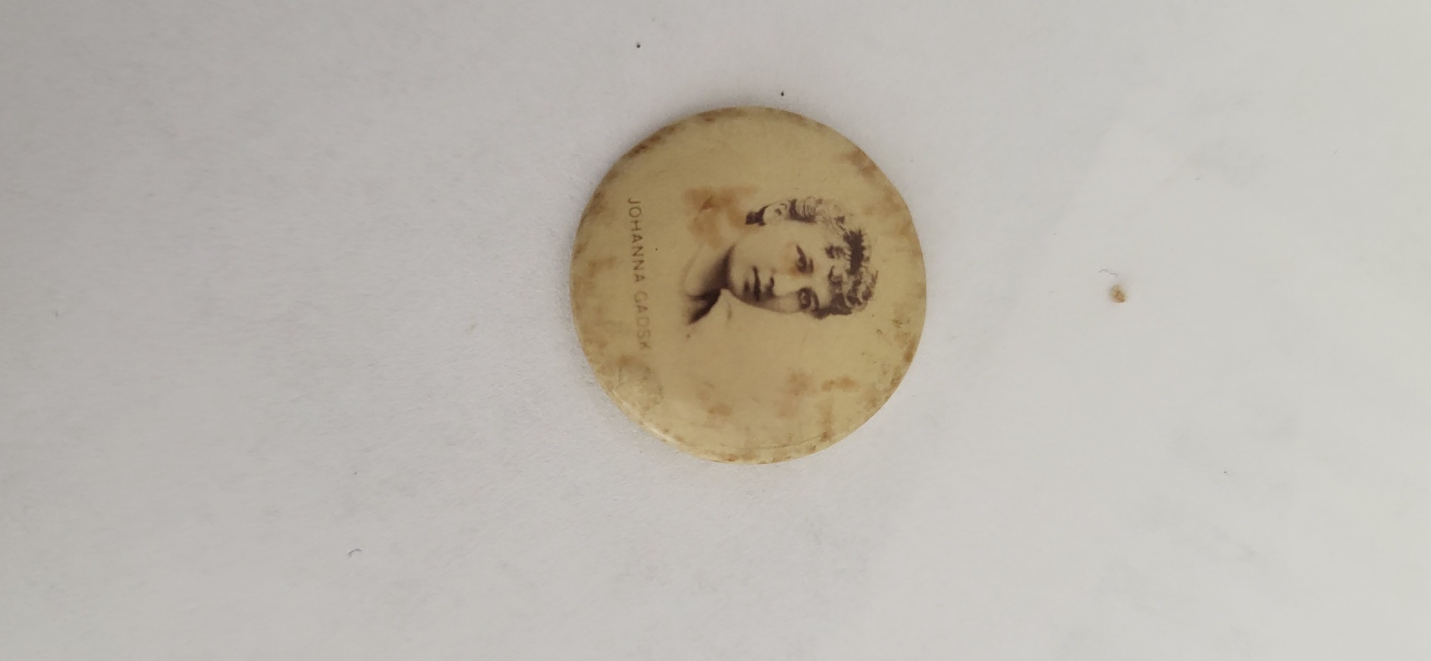 Small photographic portrait button or pinback-style badge featuring Johanna Gadski