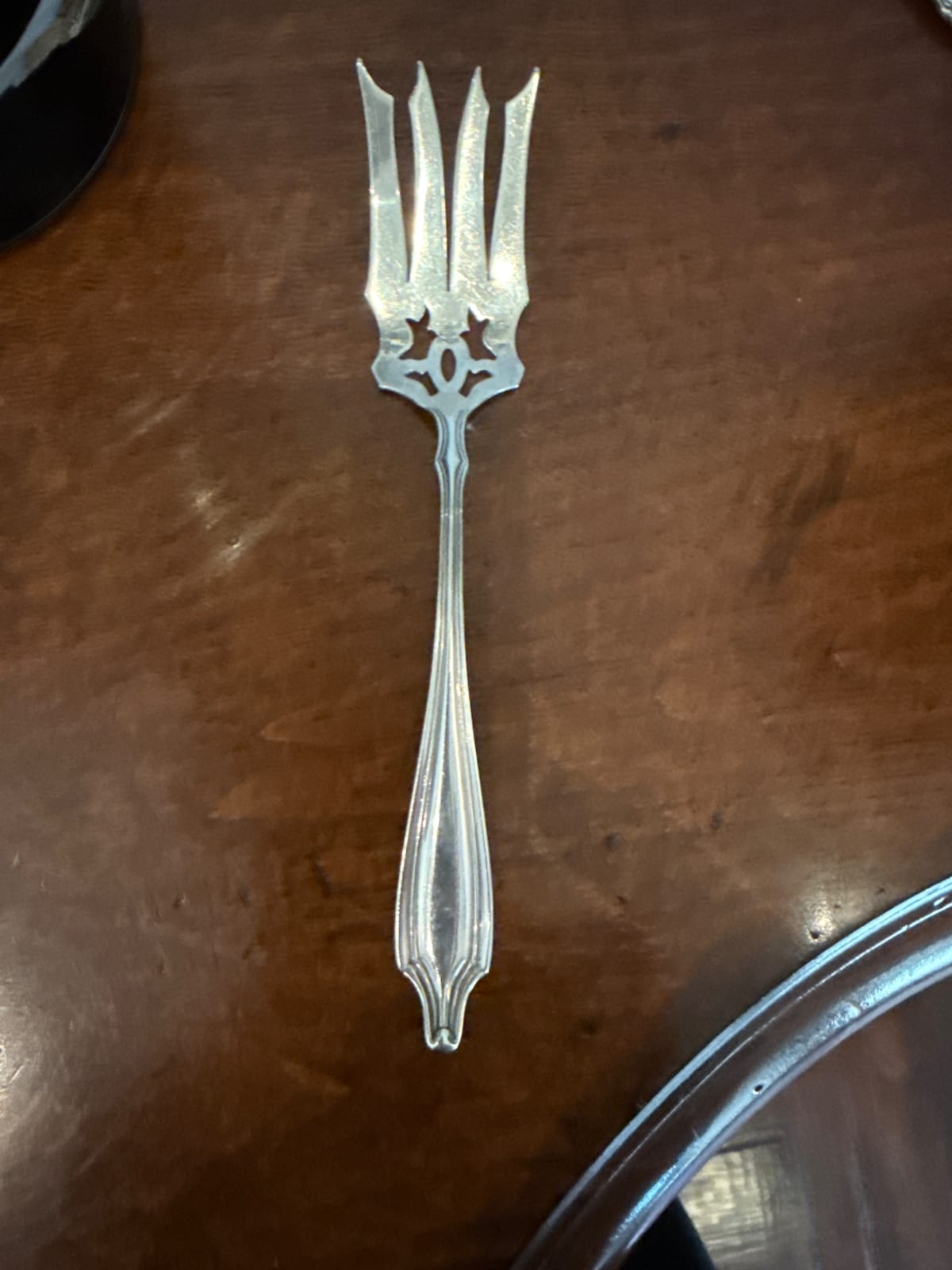 Ornate silverplate or sterling serving fork / pickle fork