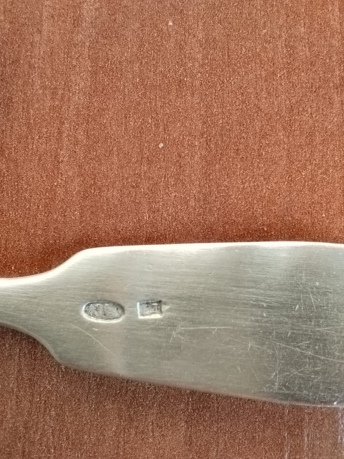 Metal blade or utensil component with hallmarks