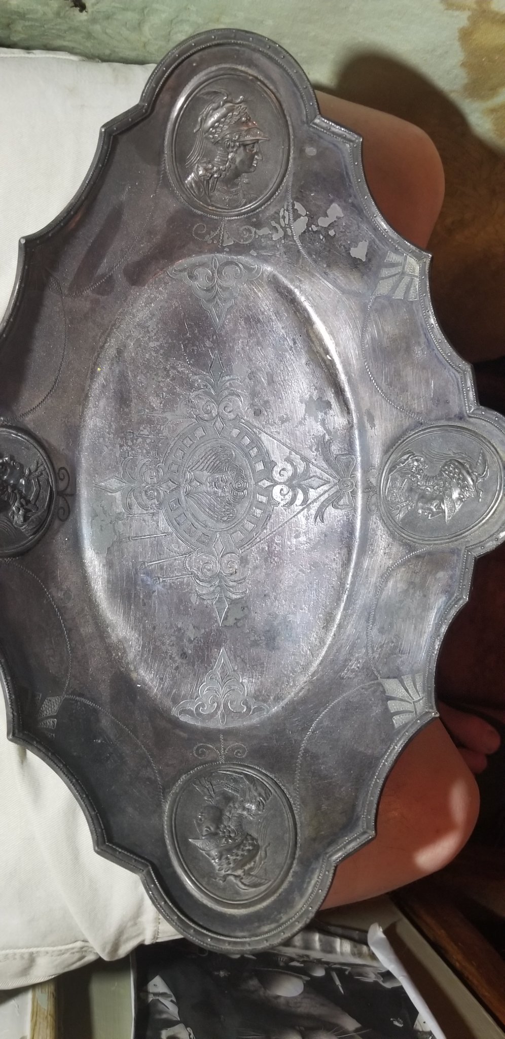 Decorative silver-plated serving tray with classical medallion portraits
