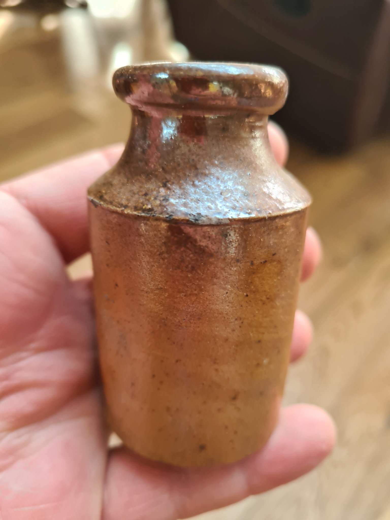 Small metal weight or counterweight (possibly a calibration weight or plumb bob component)