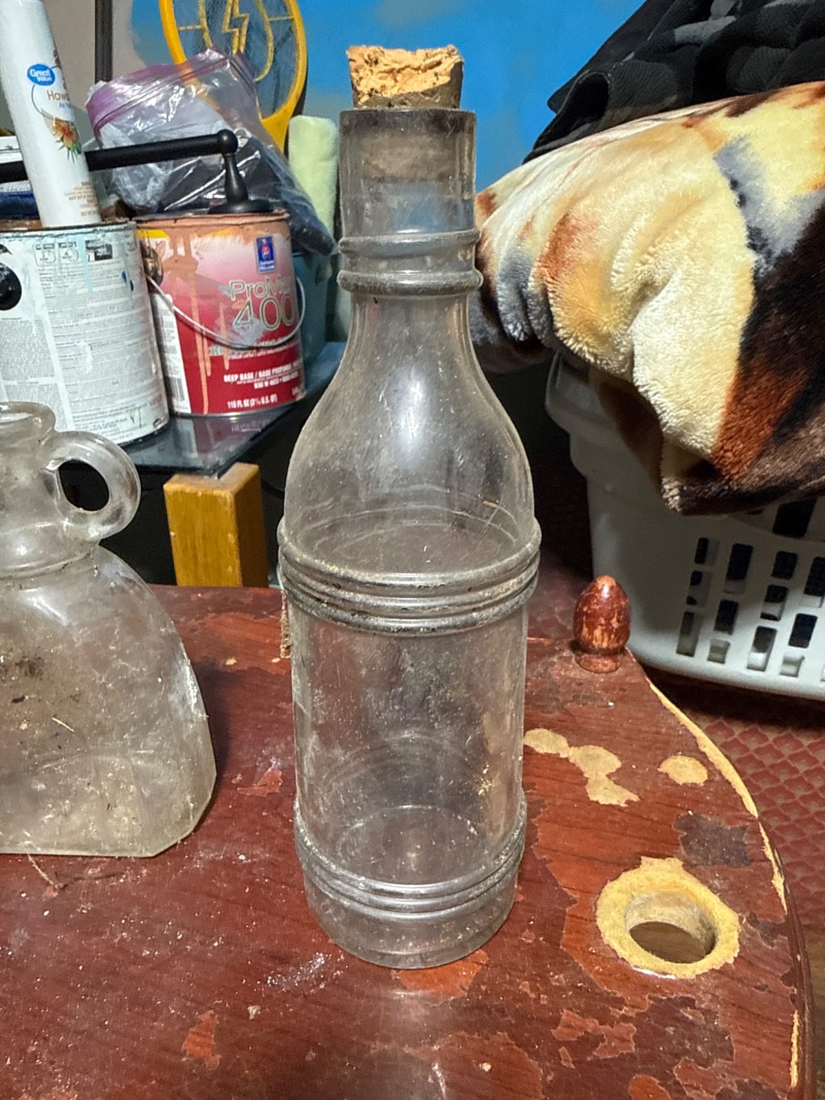 Antique glass bottle with applied ring bands and cork stopper