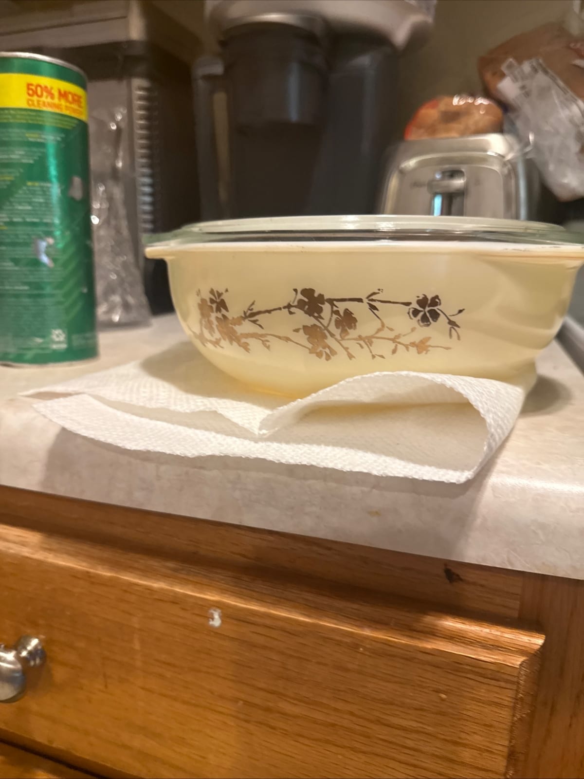 Vintage Pyrex-style glass casserole dish with floral decal and lid