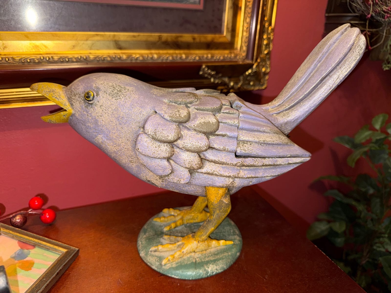 Decorative cast bird sculpture (likely a songbird or dove)