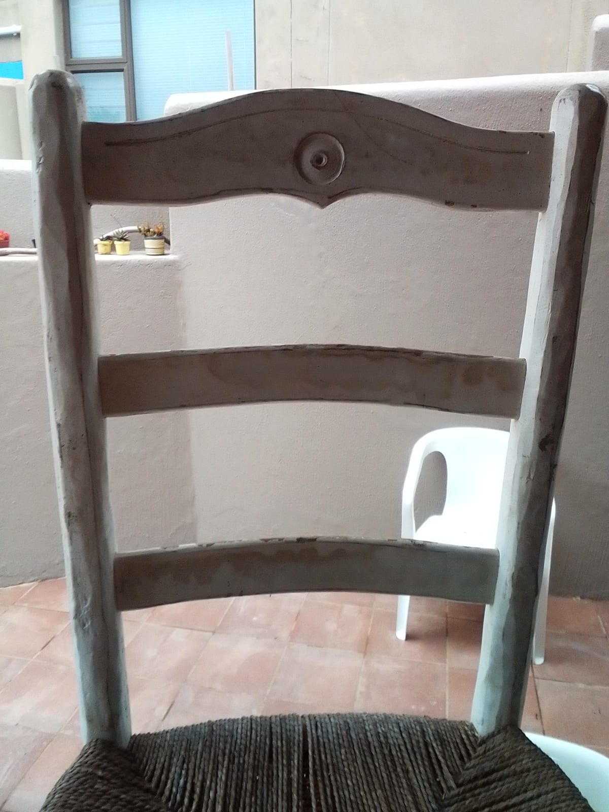 Rustic wooden ladder-back chair