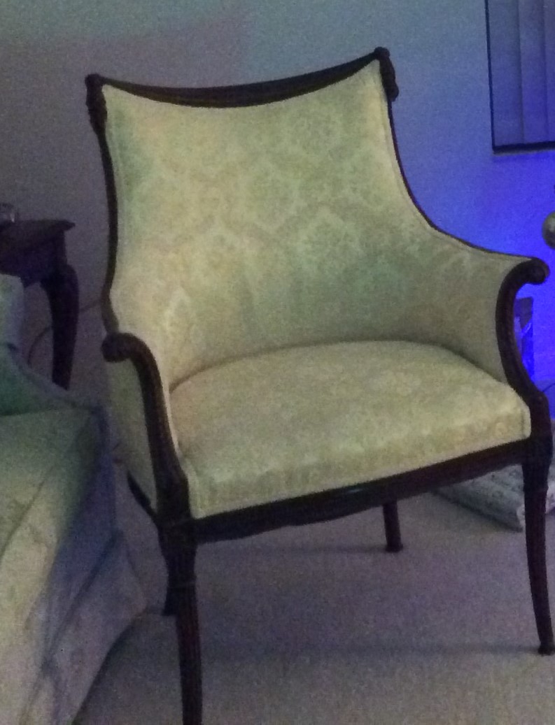 Upholstered wingback bergère-style armchair