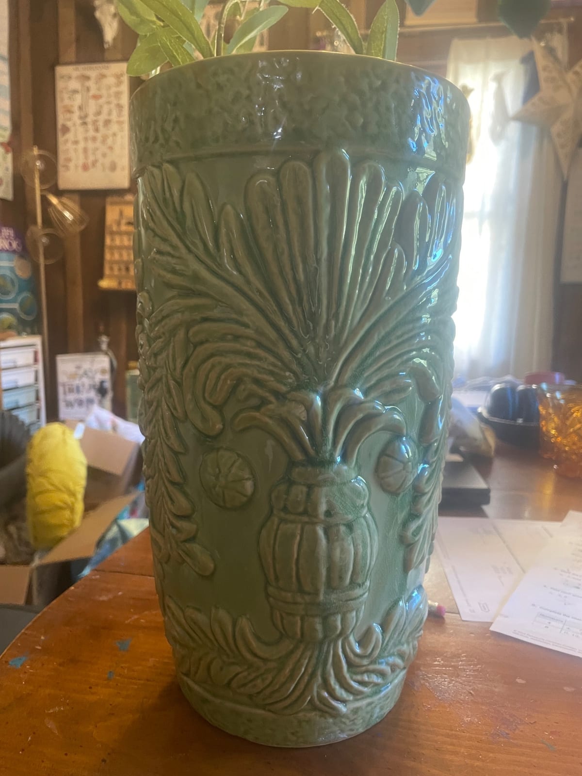 Green glazed ceramic planter or jardiniere with relief mask and foliate decoration
