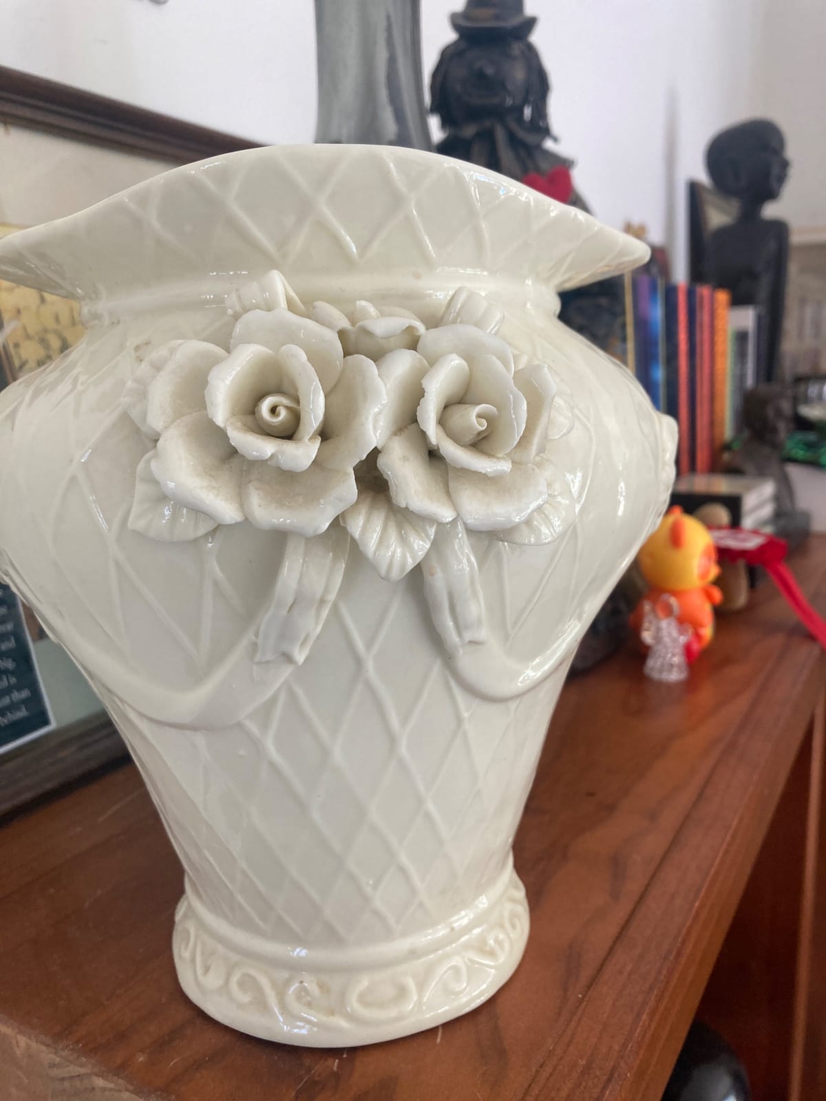 Decorative white porcelain vase with applied roses
