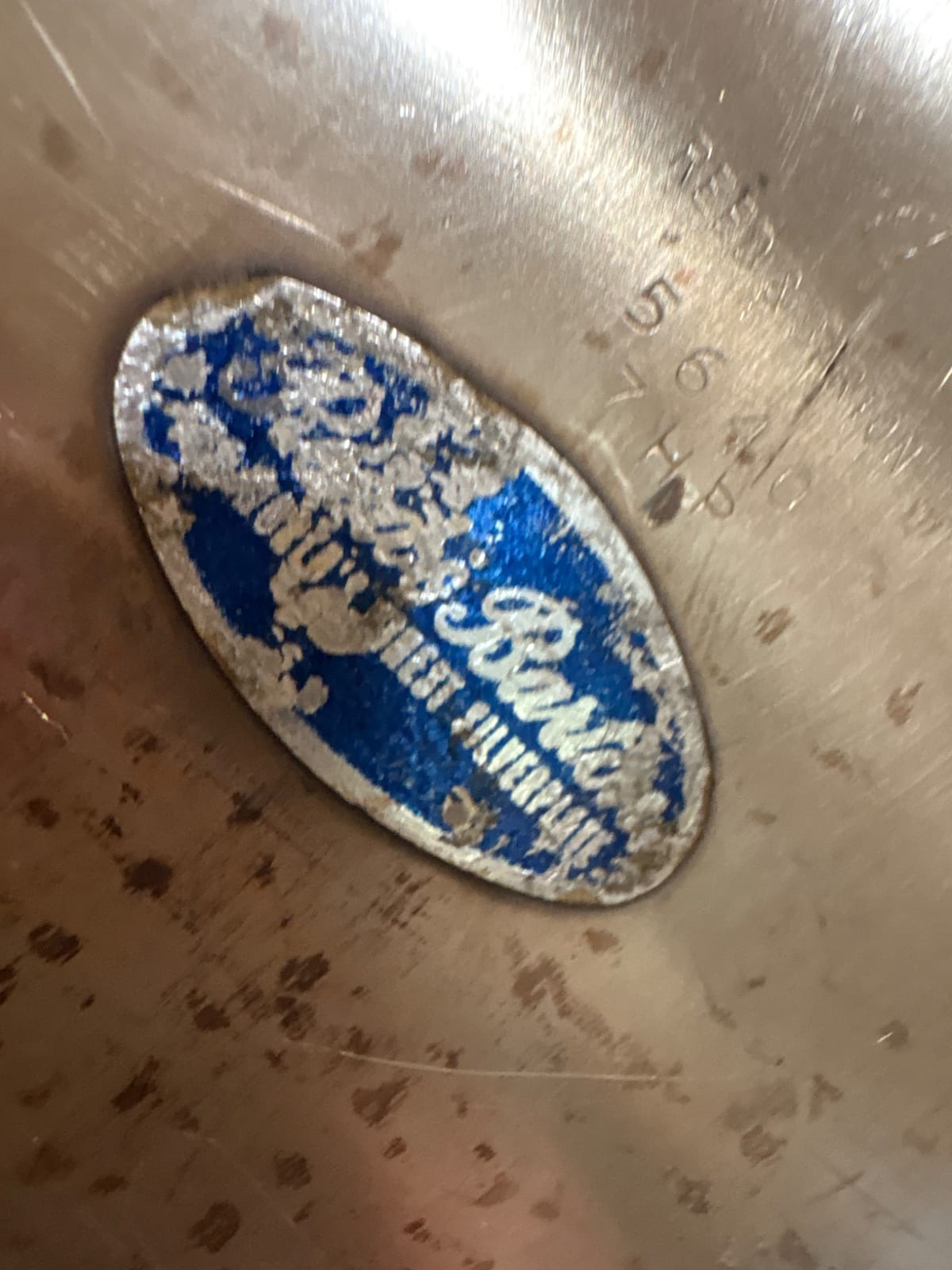 Silver-plated serving piece or hollowware item with maker's label (likely bowl, tray, or dish)