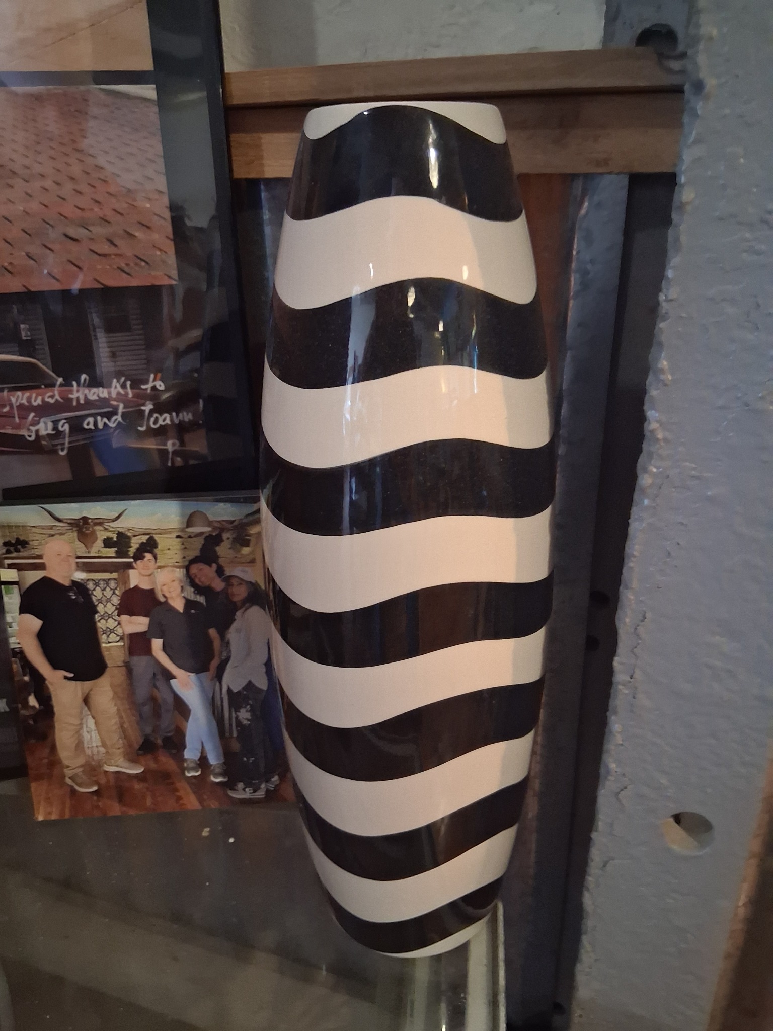 Black-and-white striped ceramic wall vase or decorative vessel