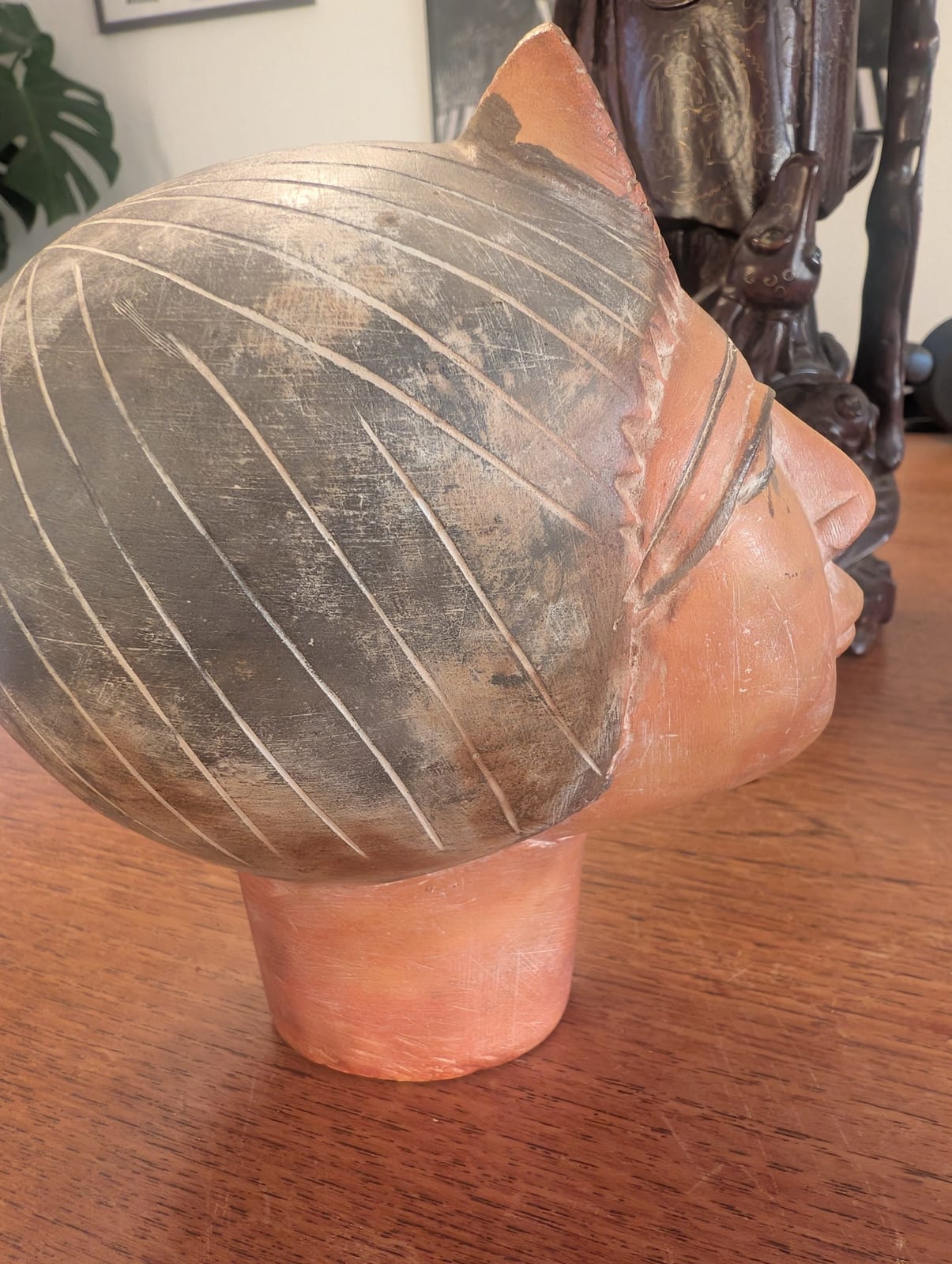 Carved wooden head sculpture