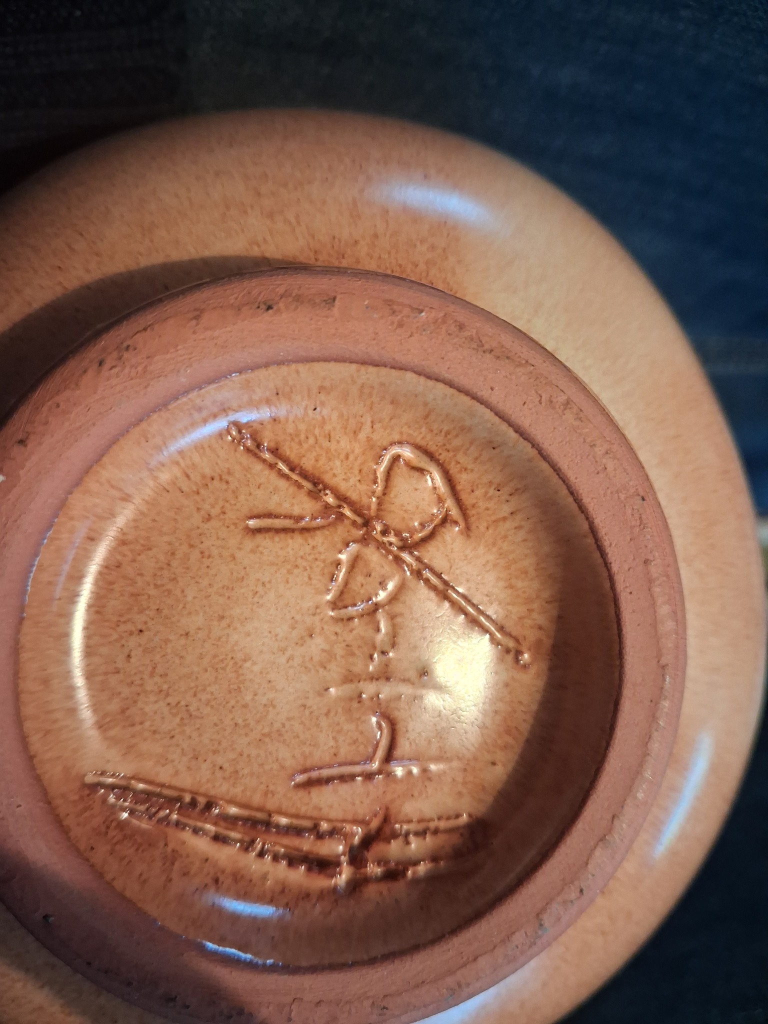 Studio pottery vessel base with incised/raised abstract mark