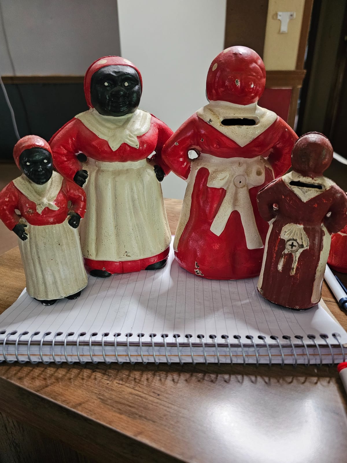 Cast iron coin bank figures (mammy-style and child figures)