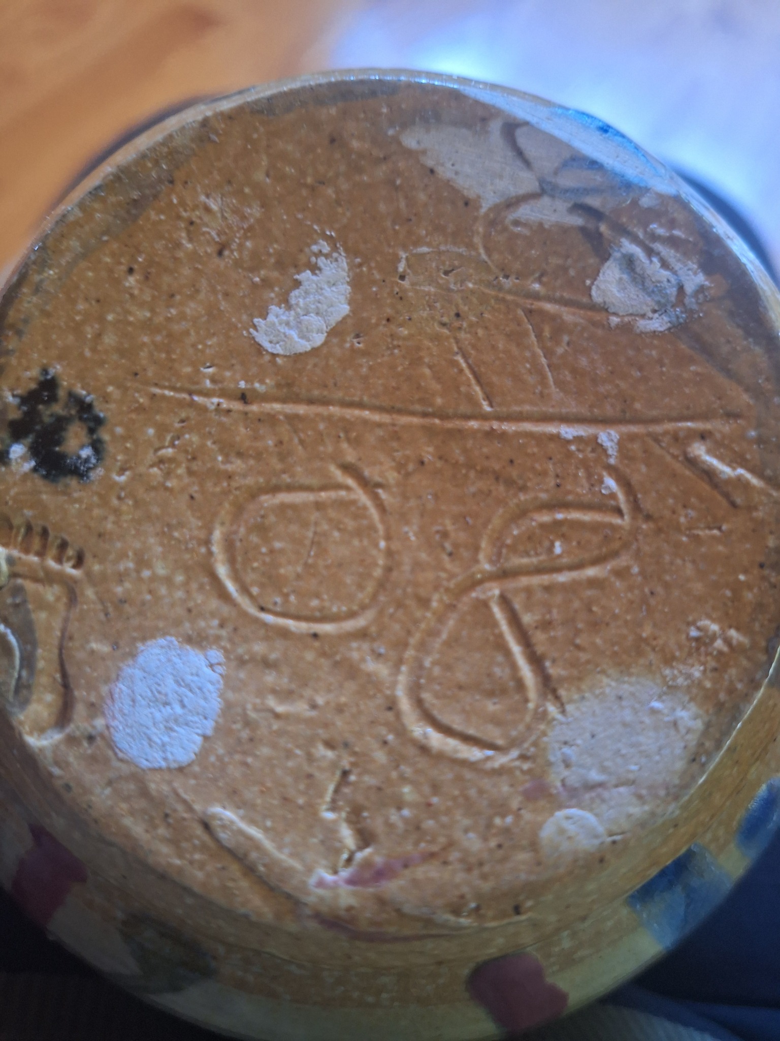 Unidentified ceramic or stoneware base with incised/pressed decoration