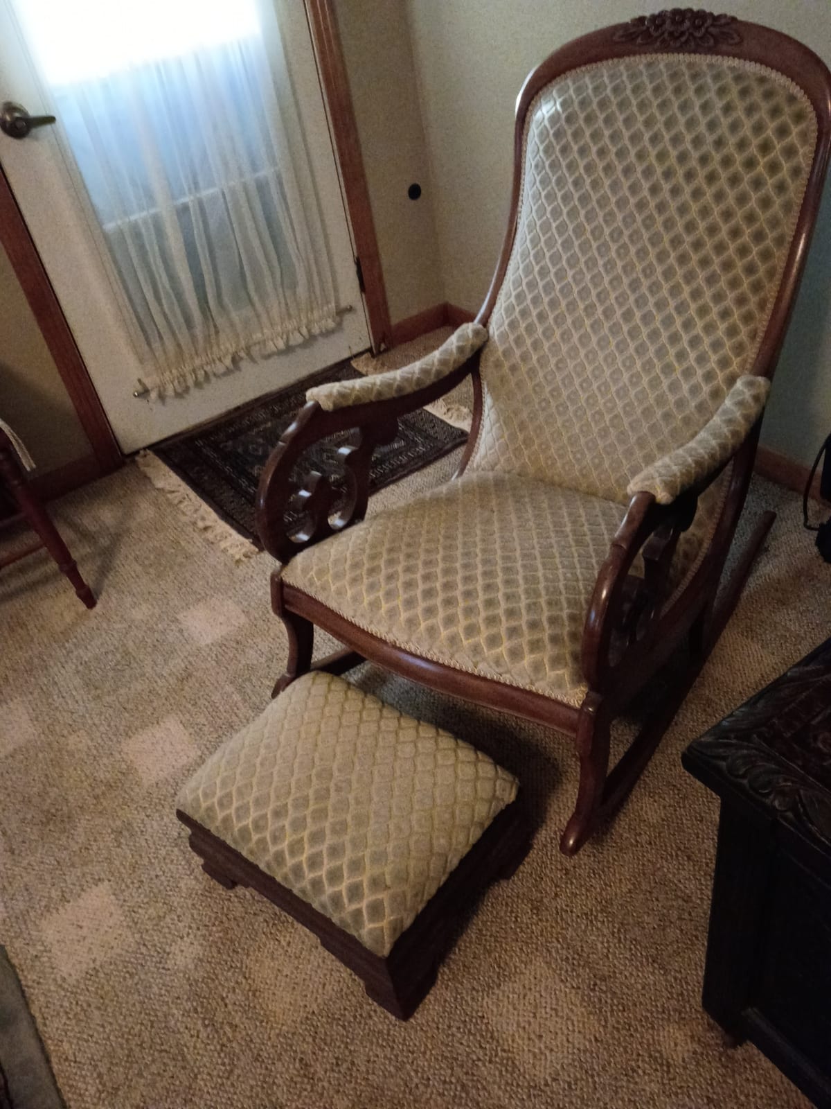 Upholstered Victorian-style rocking chair with ottoman