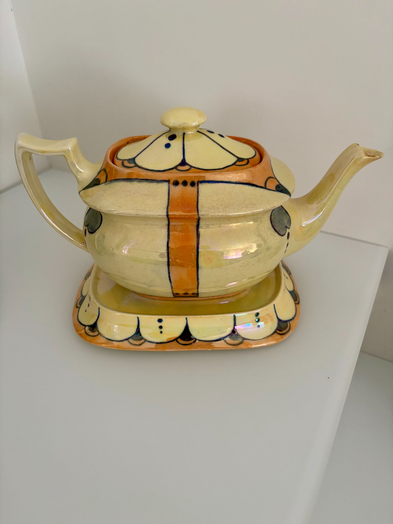 Art Nouveau-style ceramic teapot with underplate or stand